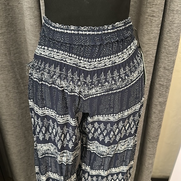 NWT multi print pants S. Never worn. They were too small for me. - Picture 2 of 5